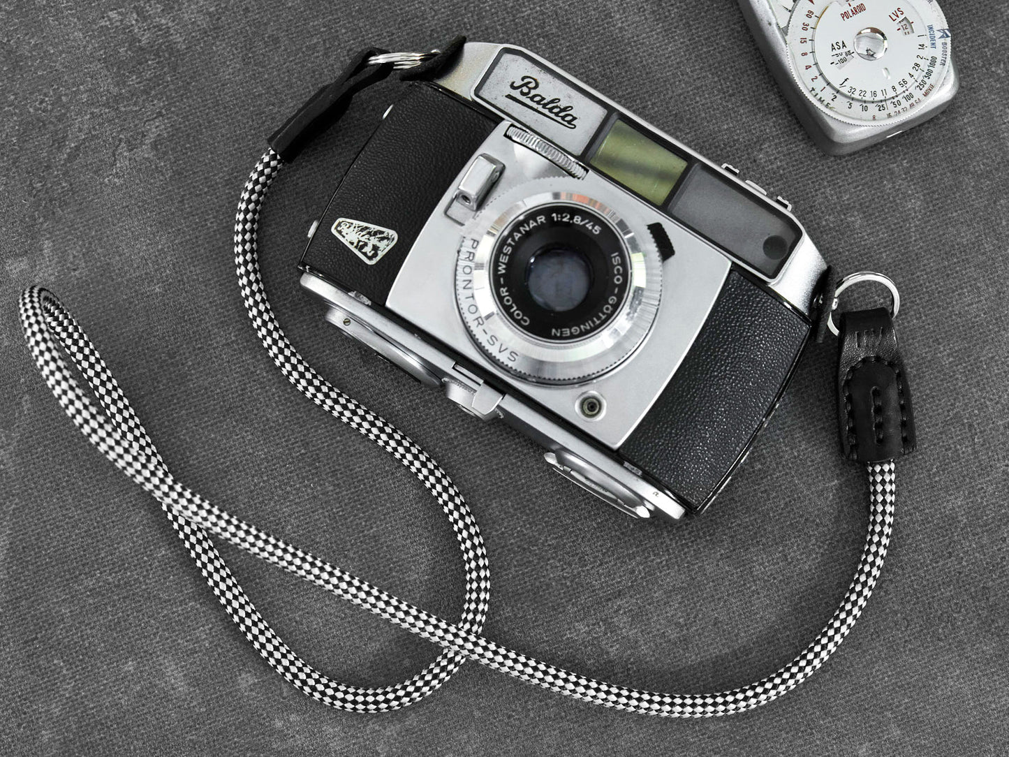 Audrey rope camera strap handcrafted by Henry and Wilde fitted to film camera with stainless steel split rings.