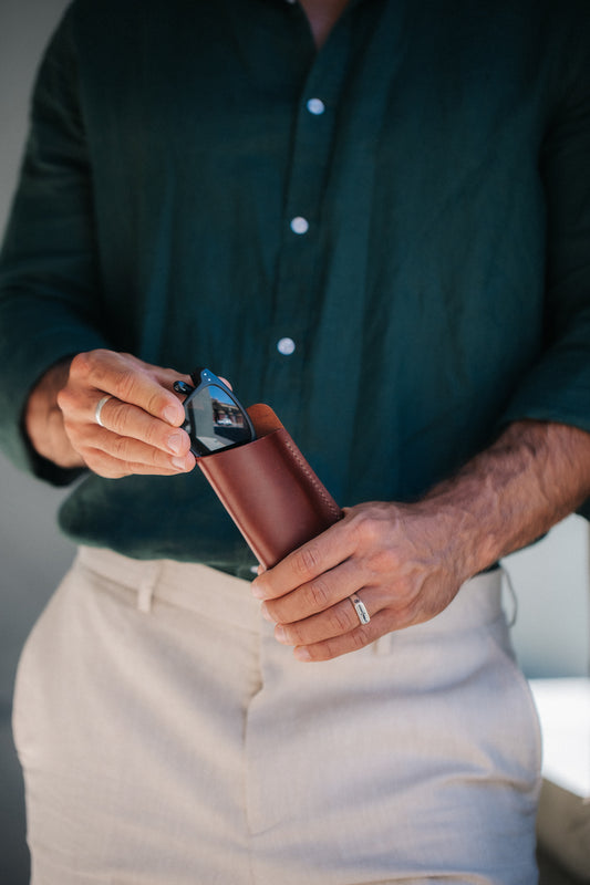 Henry and Wilde minimal Tuscan leather glasses sleeve with reading glasses partly inserted.