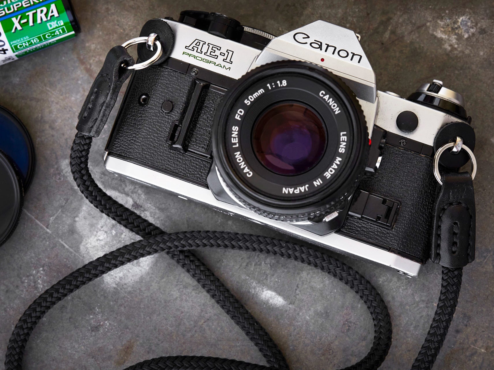 Henry and Wilde Standard Rope Camera Strap in black with hand sewn leather ends attached to a Canon AE-1 film camera.