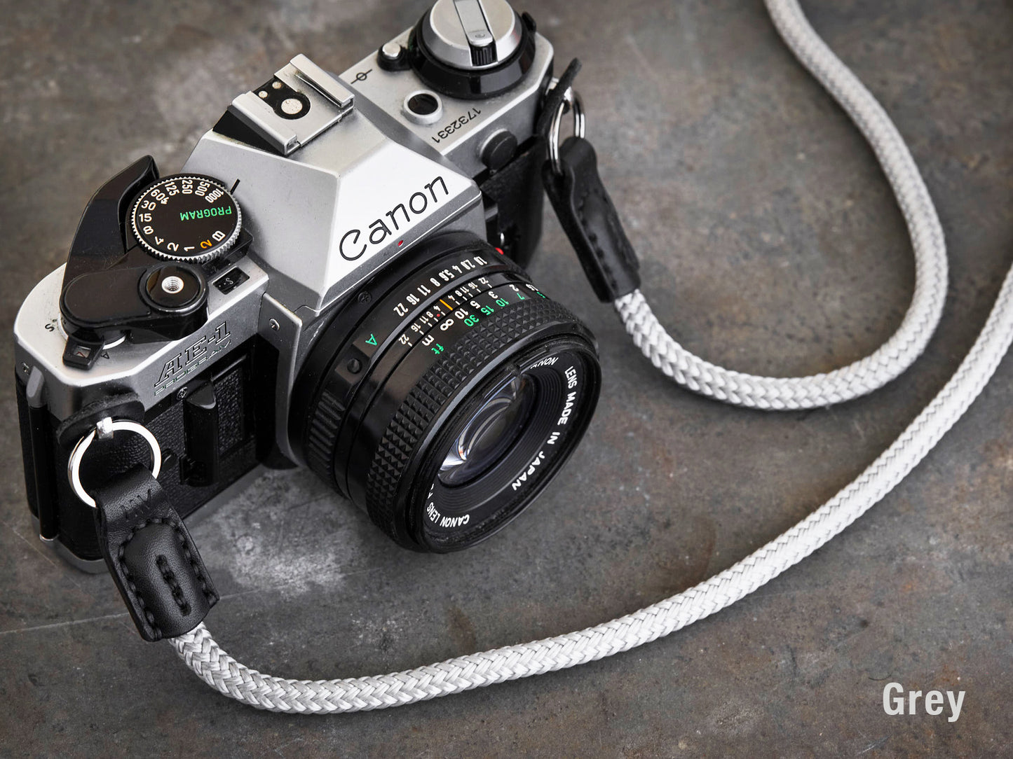 Henry and Wilde Standard Rope Camera Strap in Grey with hand sewn leather ends attached to a Canon AE-1 film camera.