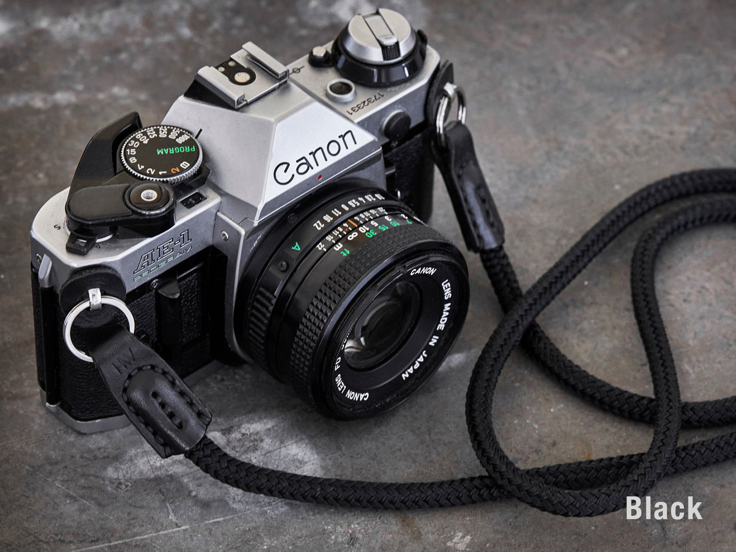 Henry and Wilde Standard Rope Camera Strap in Black with hand sewn leather ends attached to a Canon AE-1 film camera.
